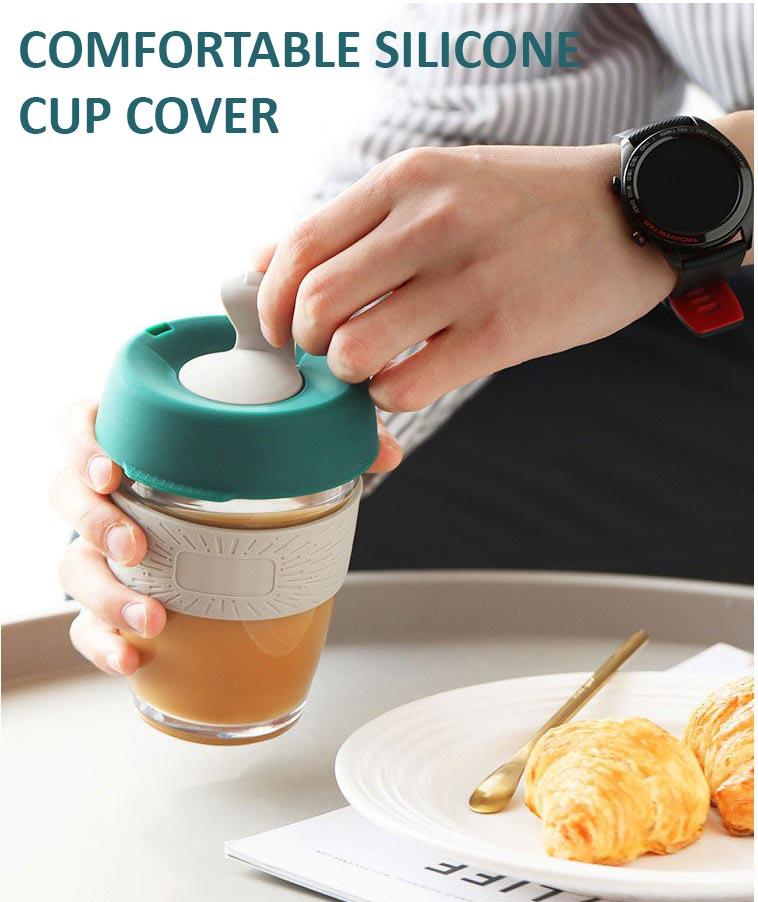 hand holding a coffee cup while opening the silicone lid cover