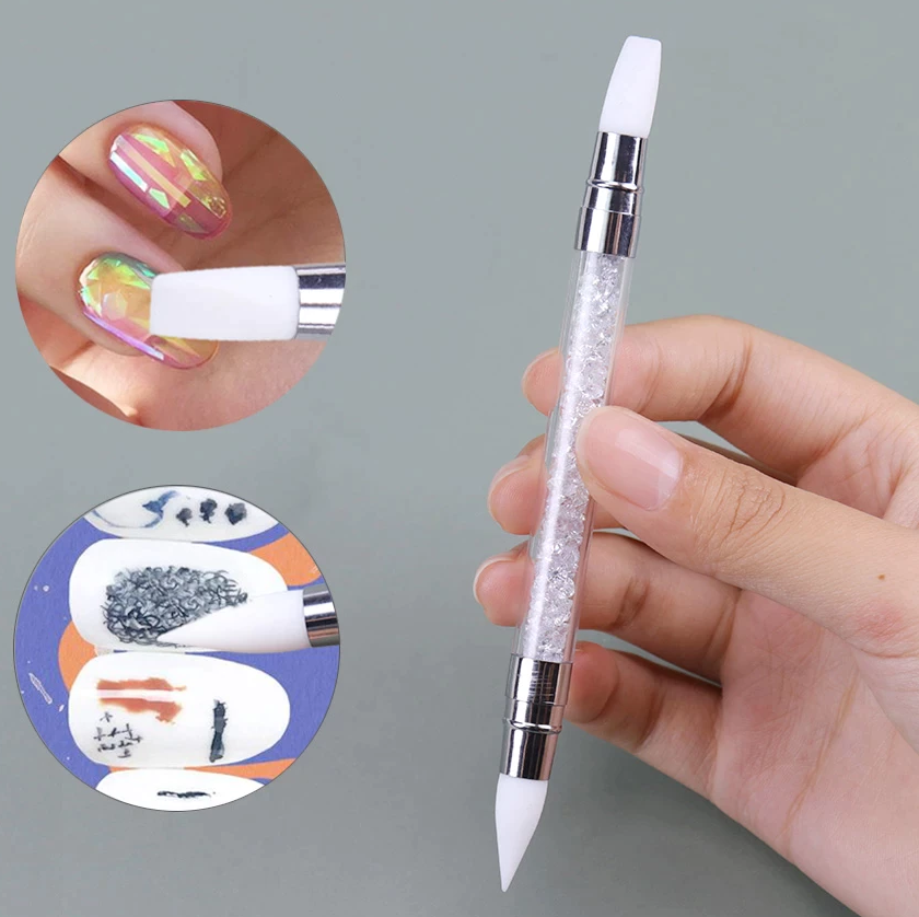 hand holding a dual ended silicone pen with artificial nails at the side