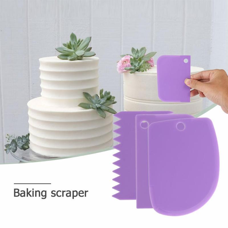 hand holding a purple baking scraper with a cake background
