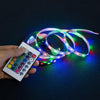 hand holding a led strip light remote control with LED strip lights 