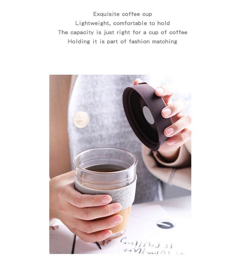 woman holding a coffee silicone cover and coffee cup