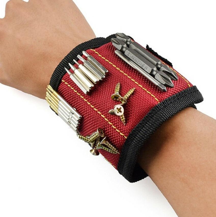 hand wearing a magnetic wristband with screws