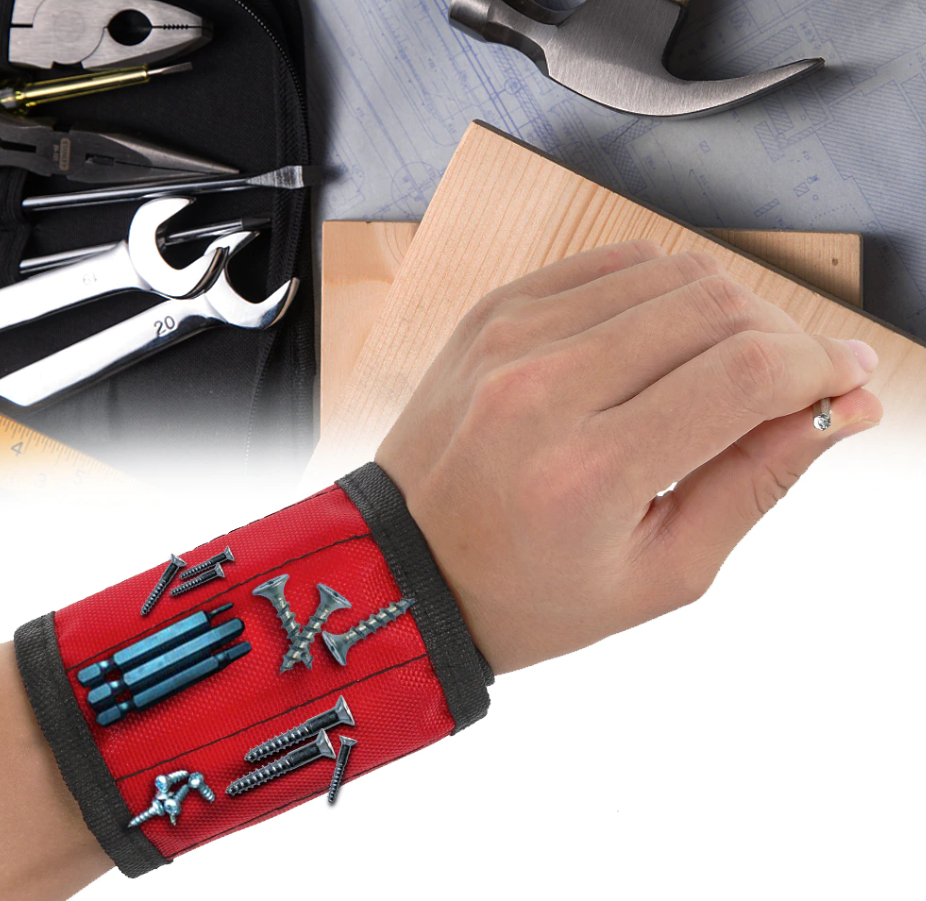 hand wearing a magnetic screw holder while holding a screw with tools background