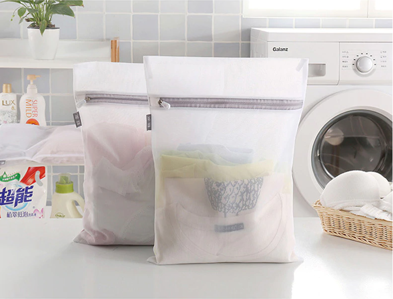 tshirts and under garments inside a mesh laundry bag