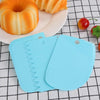 blue baking scraper with bread and cherry