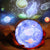 hand holding a planetary led lamp