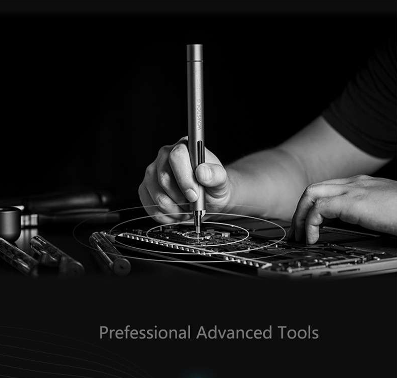 man holding an electric wowstick screwdriver while repairing an appliance