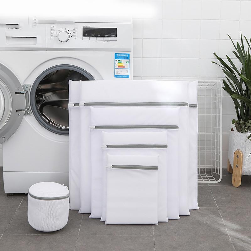 mesh laundry bag sizes with a washing machine and plant background
